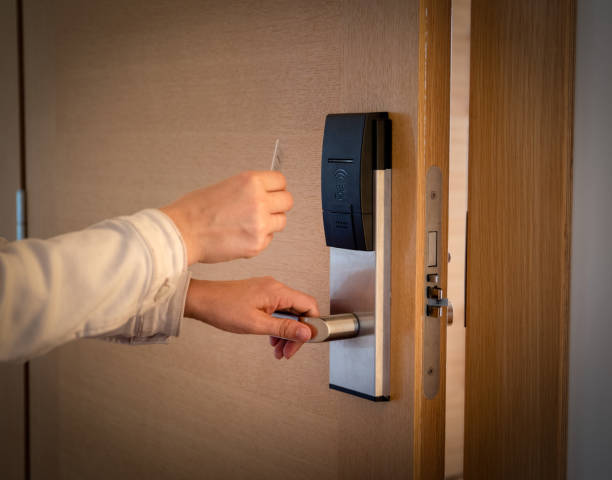 istock Opening a hotel door with keyless entry card 973655302