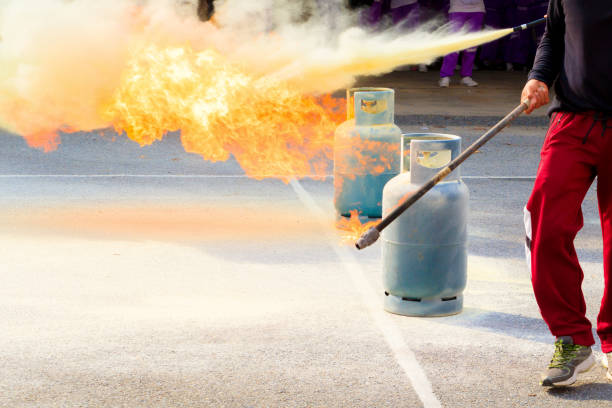 istock fire fighter Gas tank during a learning training exercise select focus with shallow depth of field. 973655606