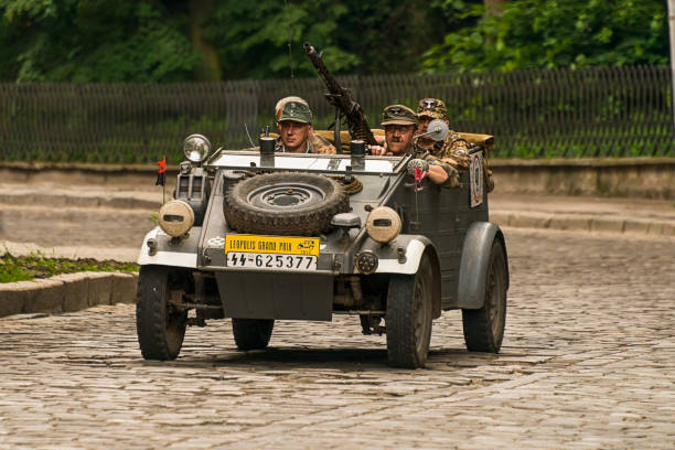 Lviv, Ukraine - June 3, 2018:Old retro car Volkswagen Typ 82 with its owner and an unknown passenger taking participation in race Leopolis grand prix 2018, Ukraine.