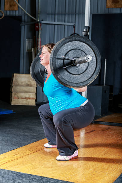 istock Pregnant Woman Cross Training Back Squat Exercise 973667728