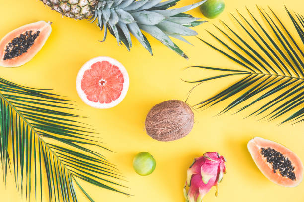 istock Summer fruits on yellow background. Flat lay, top view 973673854