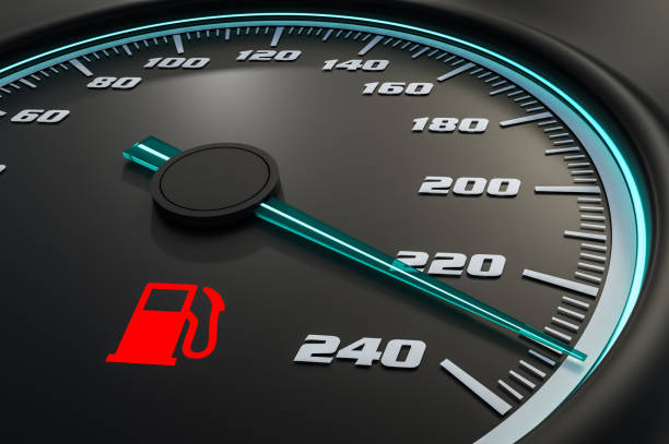 istock Red fuel level light on car dashboard 973673858