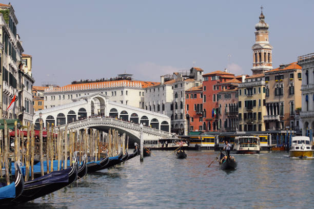 Venice, Italy - 04 05 2017: Grand Canal in Venice forms one of the major water-traffic corridors in the city. Public transport is provided by water buses and private water taxis, and many tourists explore the canal by gondola.