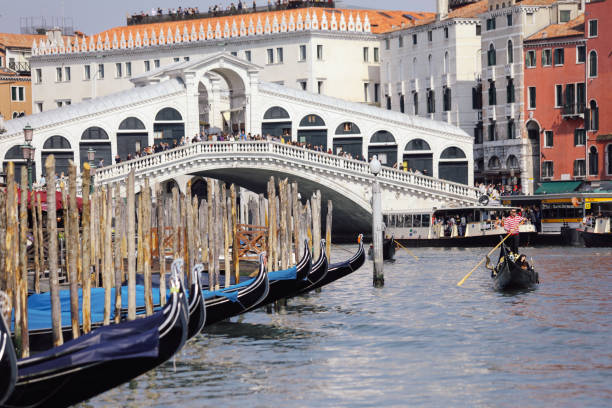 Venice, Italy - 04 05 2017: Grand Canal in Venice forms one of the major water-traffic corridors in the city. Public transport is provided by water buses and private water taxis, and many tourists explore the canal by gondola.
