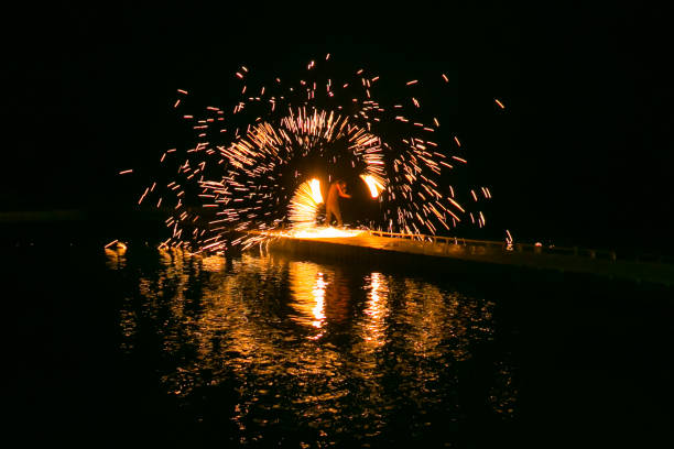 istock Fire show amazing at night 973682148