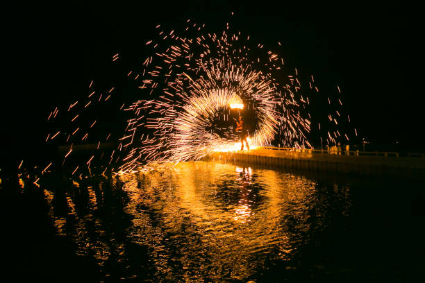 istock Fire show amazing at night 973682198