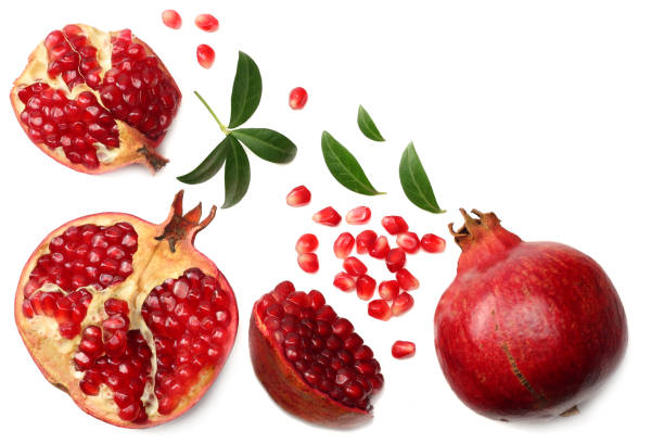 istock pomegranate fruit with green leaves isolated on a white background top view 973682420