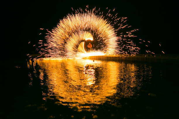 istock Fire show amazing at night 973682516
