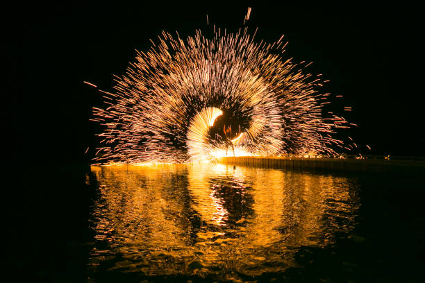 istock Fire show amazing at night 973682594