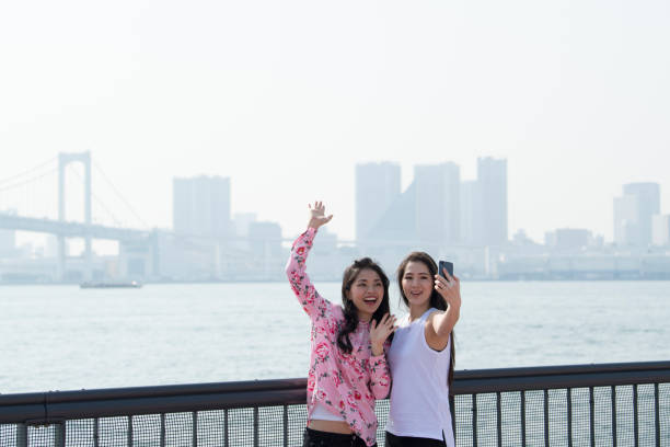 istock Commemorative photo by the seaside. 973682670