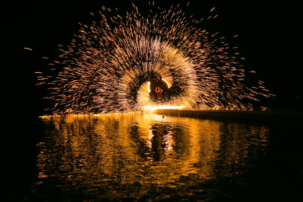 istock Fire show amazing at night 973682676