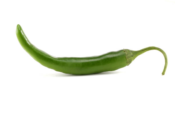 istock Green chilli pepper isolated on white background. 973685394
