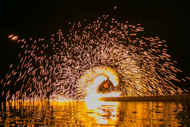 istock Fire show amazing at night 973686024