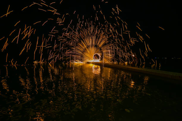 istock Fire show amazing at night 973694568