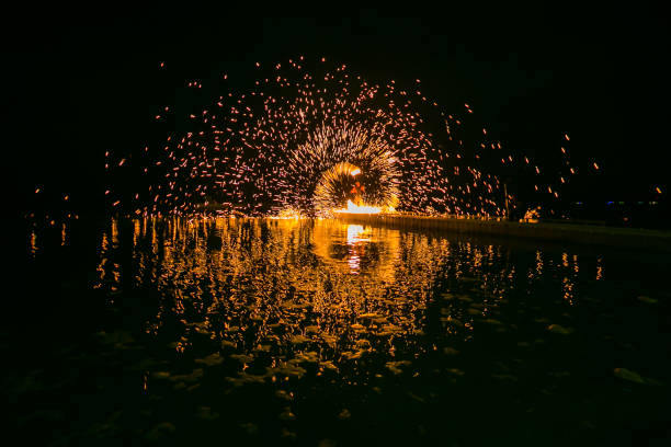 istock Fire show amazing at night 973698718