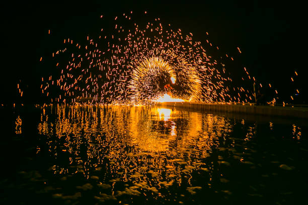 istock Fire show amazing at night 973698752
