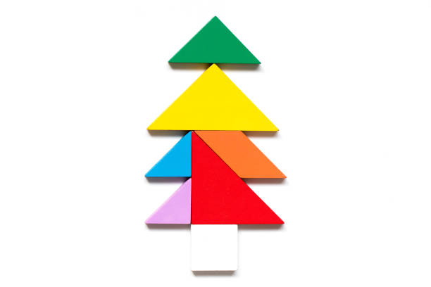 istock Color wood tangram puzzle in tree shape on white background 973701230