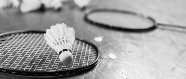 istock Badminton ball (shuttlecock) and racket on court floor 973705328