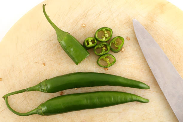 istock Pepper and cutting board isolated on the white 973708260