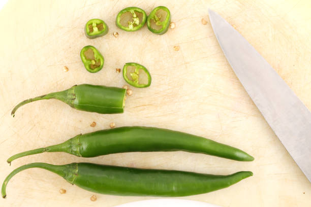 istock Pepper and cutting board isolated on the white 973708264