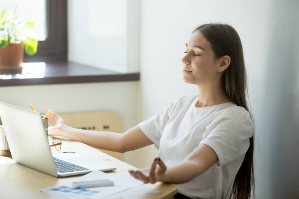 istock Concentrated female meditating in mudra position 973708784