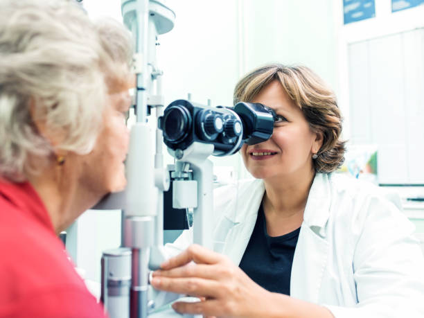 istock Senior woman visiting optician. 973714834