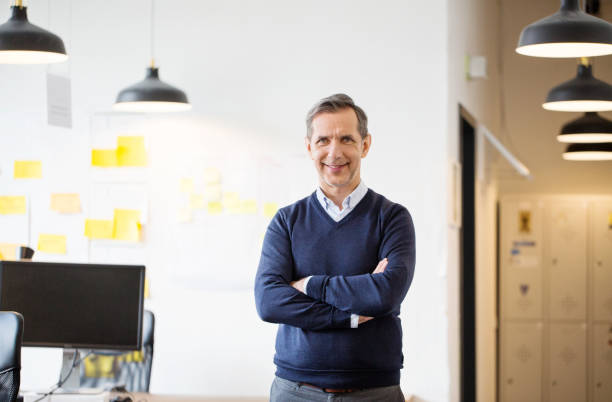 istock Smiling mature businessman in office 973714866