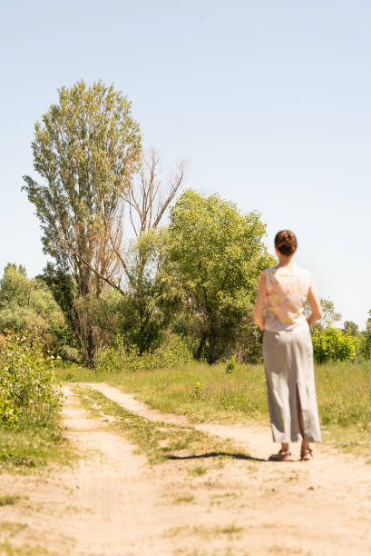 istock Woman Watching to the Trees 973715556
