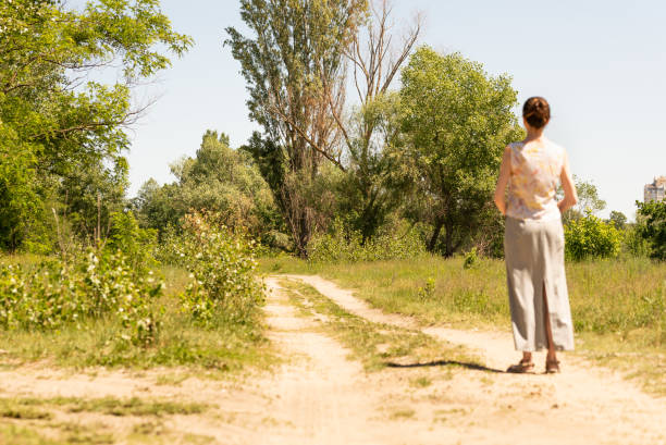 istock Woman Watching to the Trees 973715610
