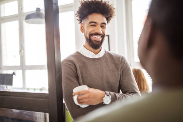 istock Professionals having a casual discussion in break 973715938