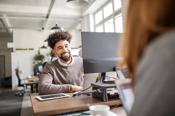 Happy business professionals working in office