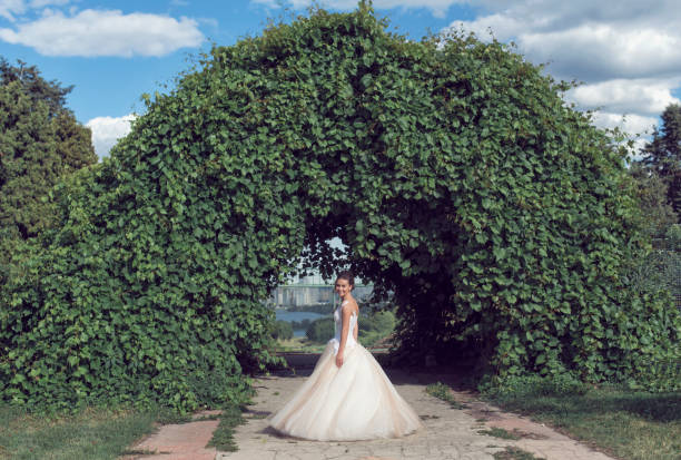 istock A summer walk with the bride in the park 973718800