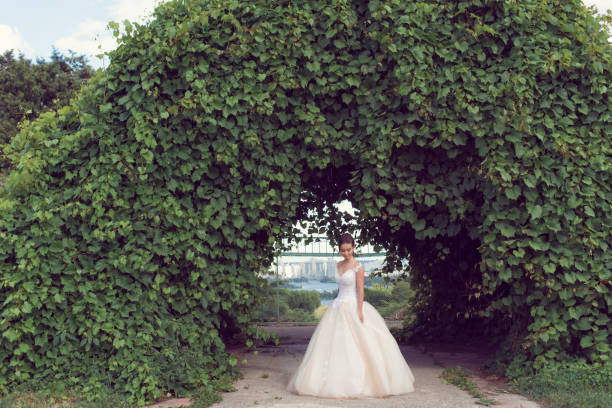 istock A summer walk with the bride in the park 973718912