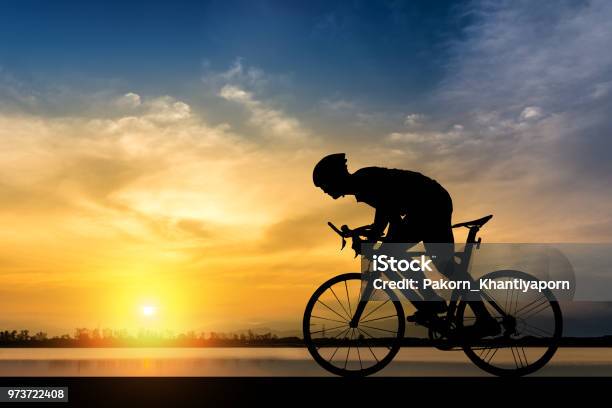 Silhouette Of Cyclist On The Background Of Beautiful Sunset Stock Photo - Download Image Now