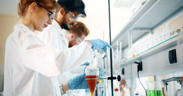 istock Group of chemistry students working in laboratory 973723376