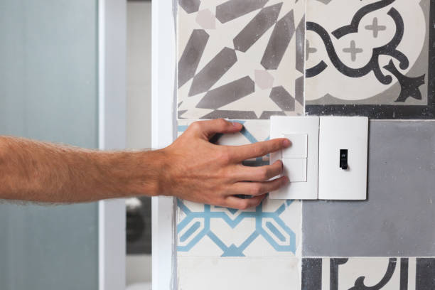 istock Close up of finger is turning on or off on light switch 973726190