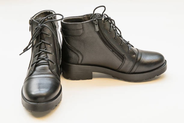 istock Black leather ladies boots isolated on a white 973730826