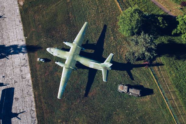 istock Above drone view on military propeller transport aircraft 973735896