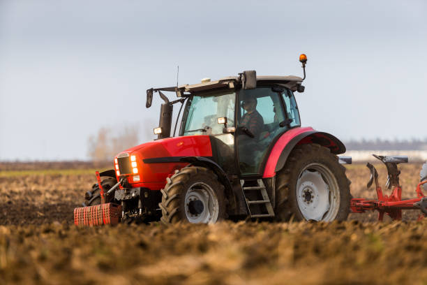istock Farmer plowing stubble field 973735928
