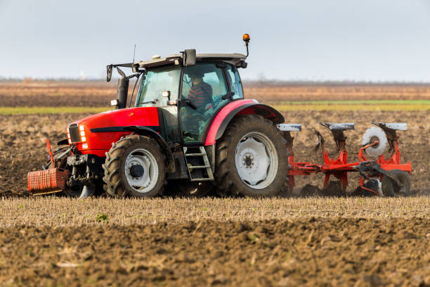 istock Farmer plowing stubble field 973736182