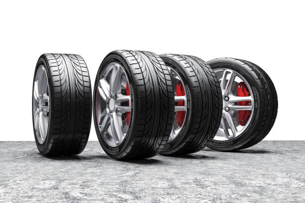 istock 3d car tires and alloy wheels 973736276