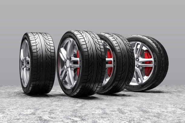istock 3d car tires and alloy wheels 973736350
