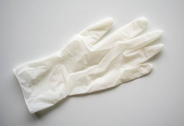 White medical glove isolated on white background stock photo