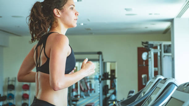 istock Side view of woman training hard 973739478