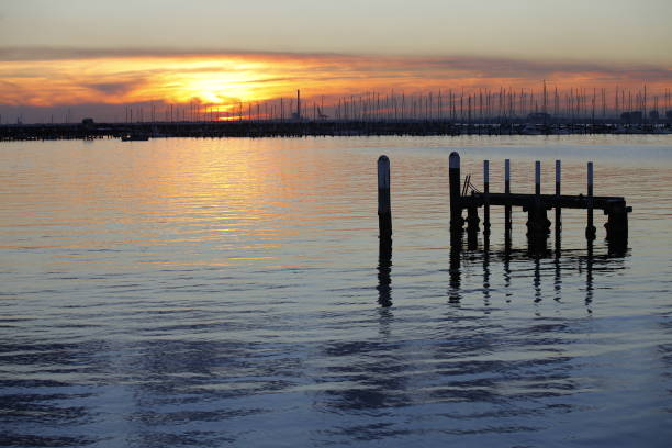 sunset silhouette image at st kilda pier, melbourne australia