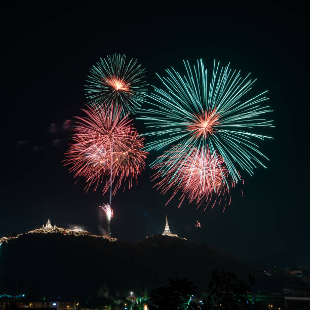istock Amazing colorful colorful firework display on dark sky for celebration night event 973745722