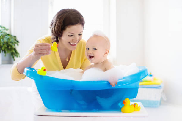 Mother and baby in bath