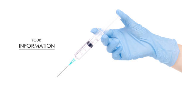 istock Syringe medical in hand medical gloves pattern 973758082