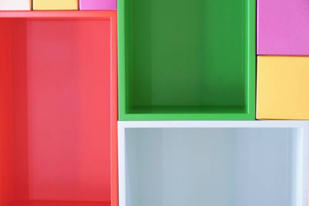 multi colored boxes in the shelf - shelf bookshelf empty box imagens e fotografias de stock