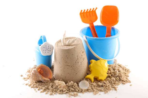 istock holiday concept, sand and baby toy 973759098